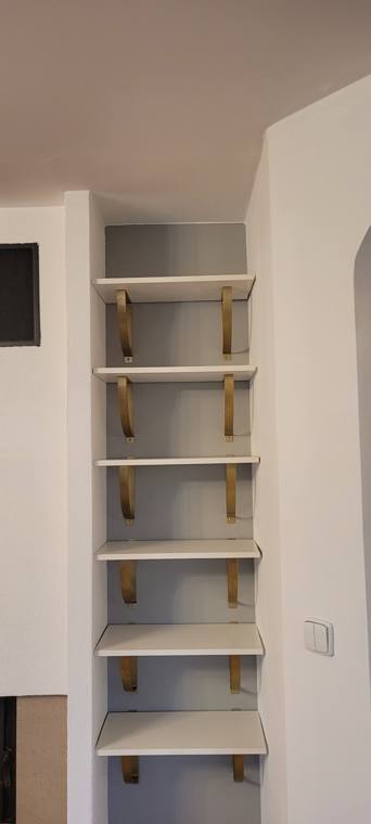 Shelves with brass brackets
