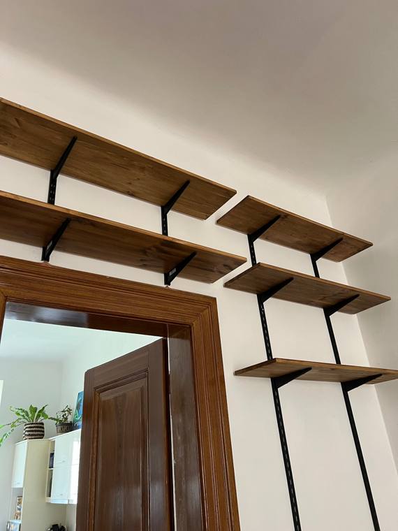 Wall shelves on black rails